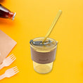 Glass coffee mug with straw and lid, perfect for travel